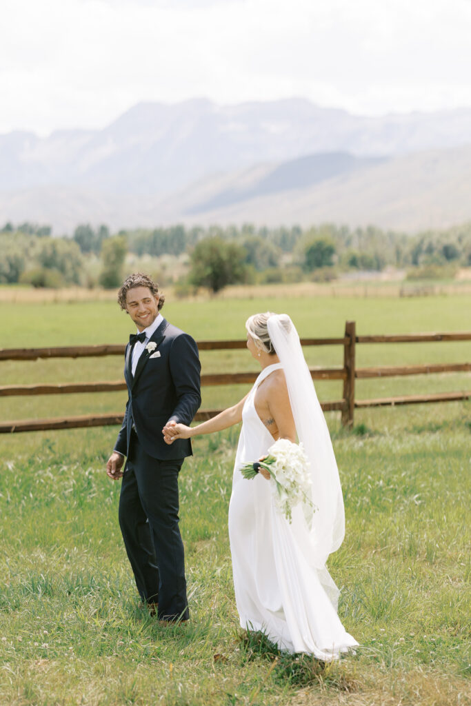 Cascading bridal bouquet with white orchids and calla lilies at a luxury Jewish wedding at River Bottoms Ranch in Midway Utah