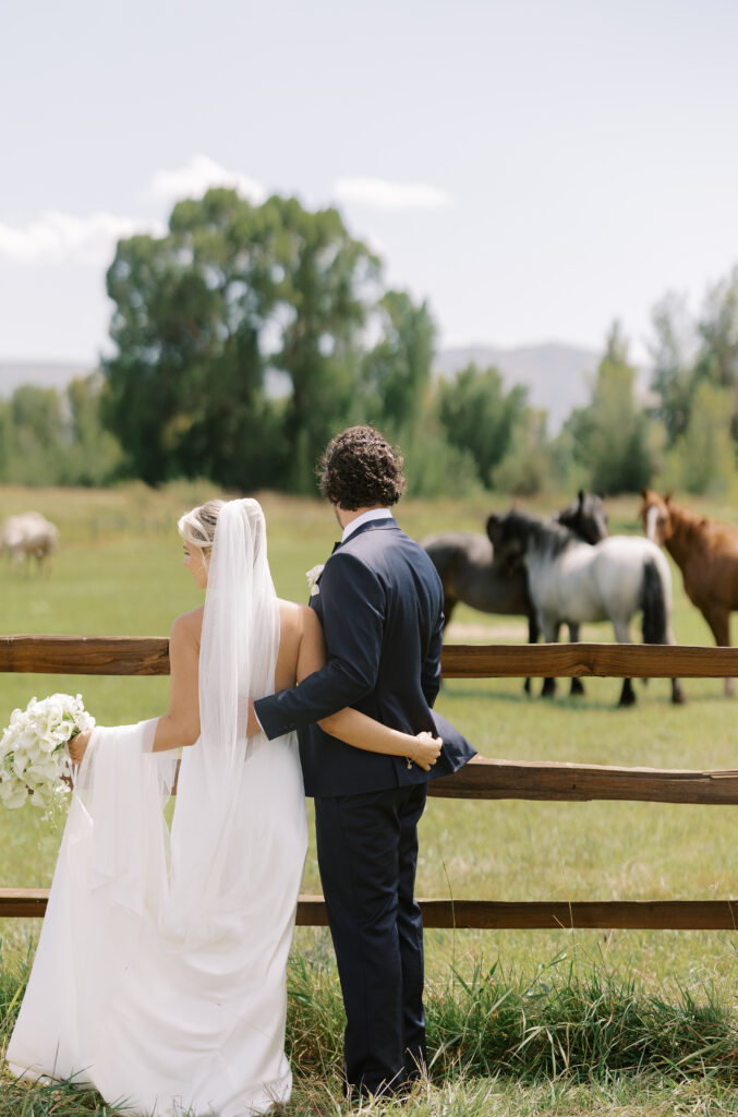 Elegant cascading bridal bouquet of white orchids and calla lilies designed by a Utah wedding florist- Market Floral