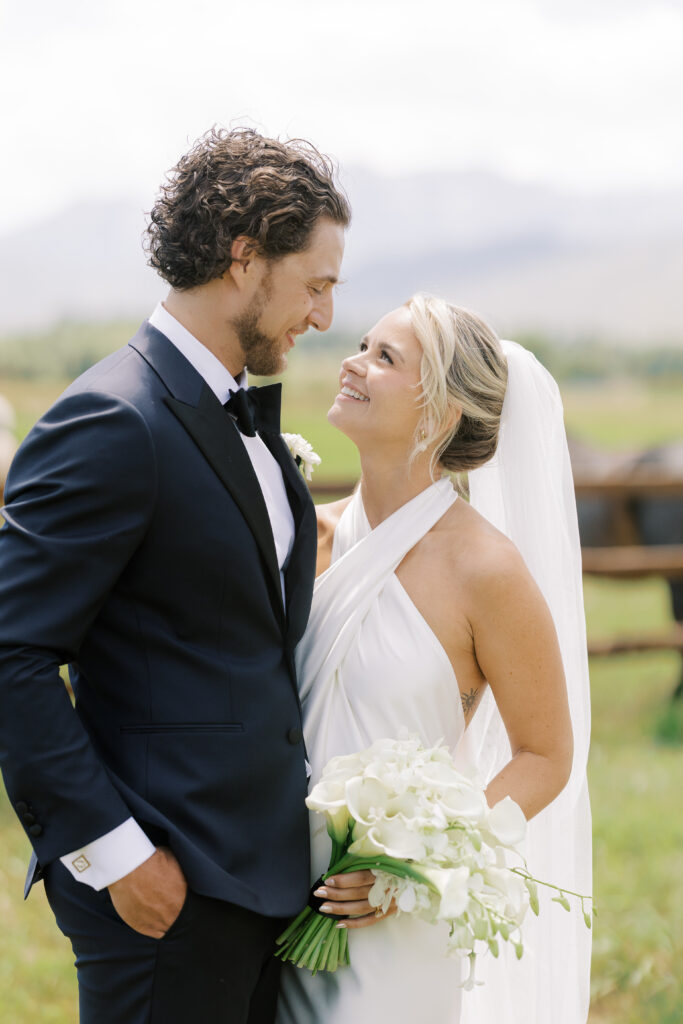 Statement cascading orchid and calla lily bridal bouquet at River Bottoms Ranch wedding