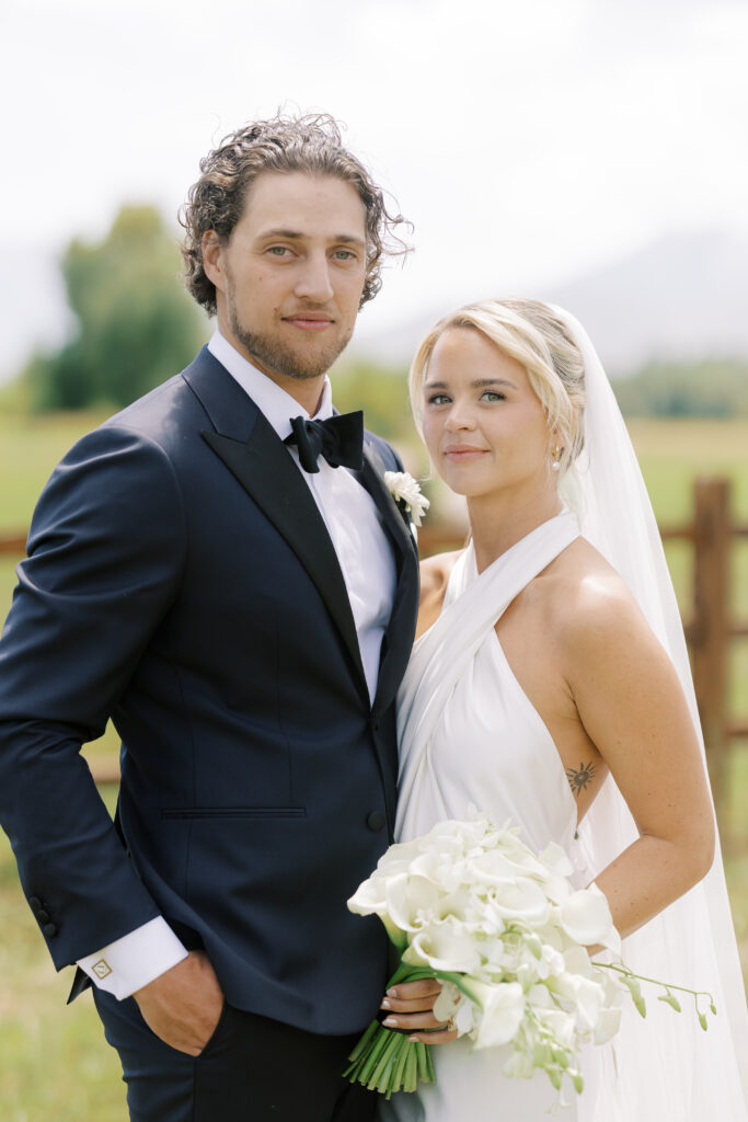 Statement cascading orchid and calla lily bridal bouquet at River Bottoms Ranch wedding